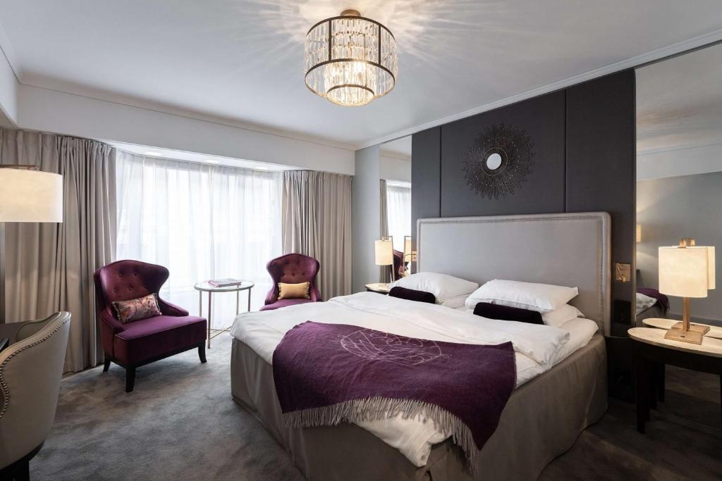 Postel nebo postele na pokoji v ubytování Grand Hotel Oslo