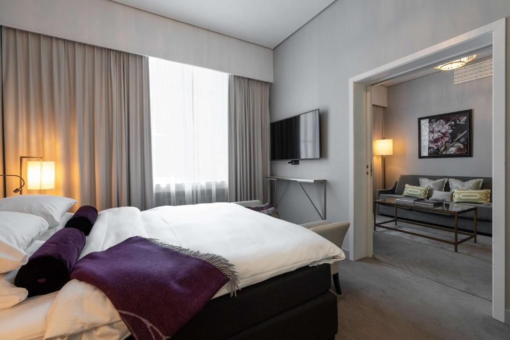 Postel nebo postele na pokoji v ubytování Grand Hotel Oslo