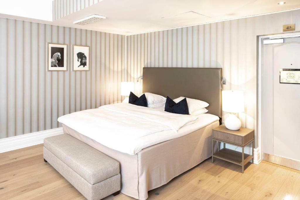 Postel nebo postele na pokoji v ubytování Grand Hotel Oslo