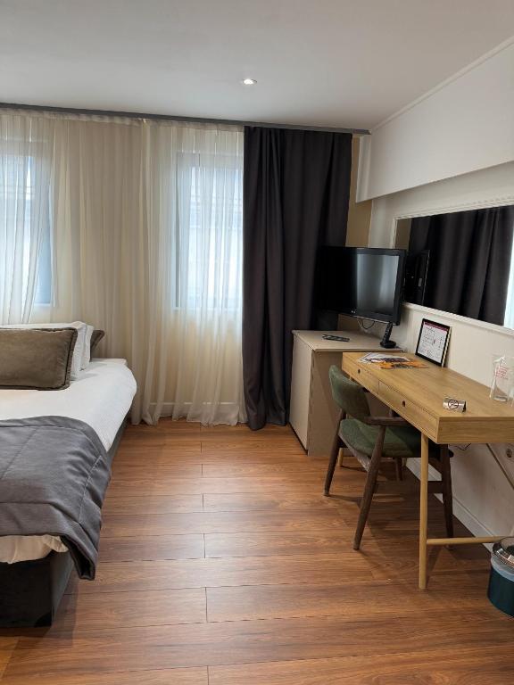 Postel nebo postele na pokoji v ubytování Hotel Astra