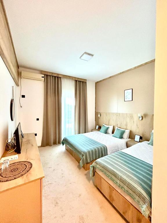 Postel nebo postele na pokoji v ubytování El Mar Hotel