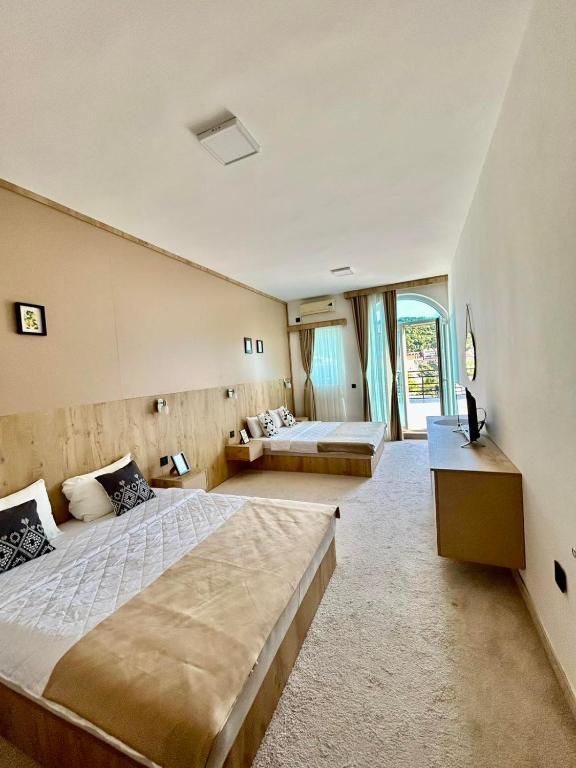 Postel nebo postele na pokoji v ubytování El Mar Hotel