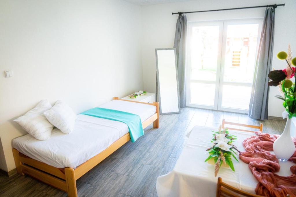 Postel nebo postele na pokoji v ubytování Penzion Kravín