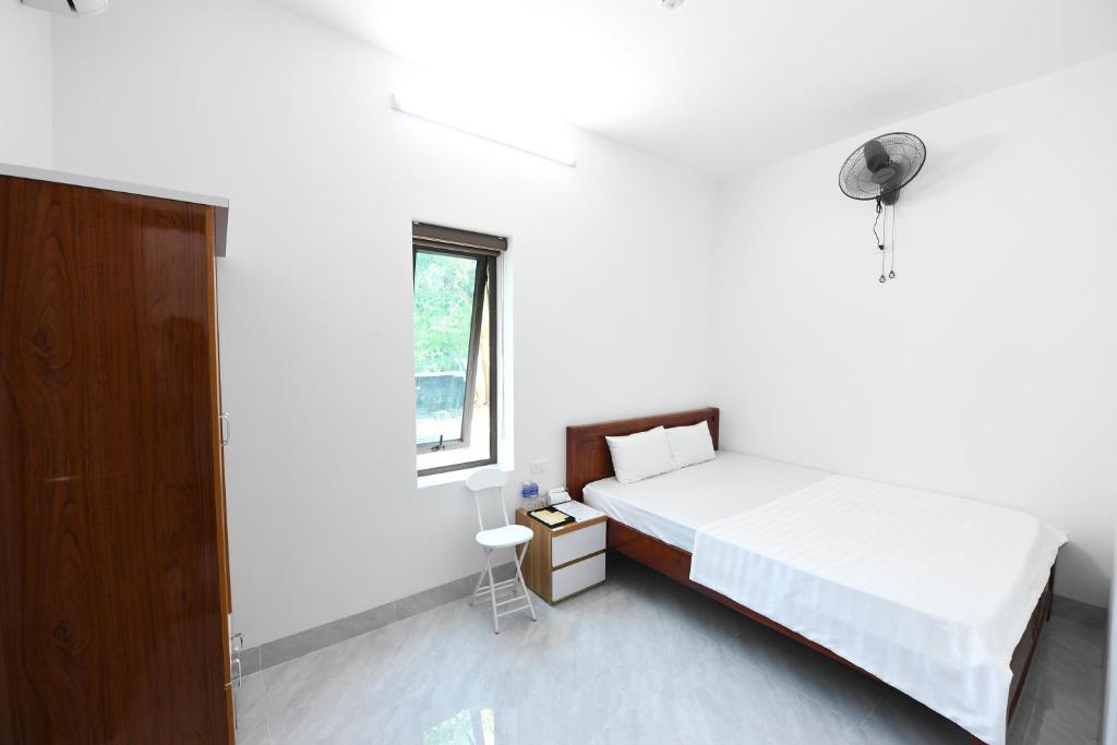 Postel nebo postele na pokoji v ubytování Hoàng Anh Hotel