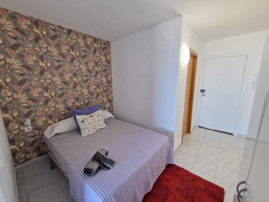 Posteľ alebo postele v izbe v ubytovaní APARTAMENTO BLUE SEA
