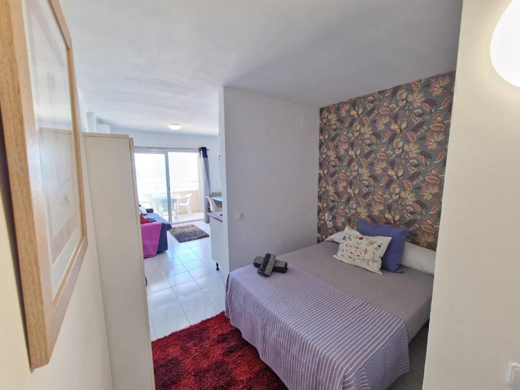 Posteľ alebo postele v izbe v ubytovaní APARTAMENTO BLUE SEA