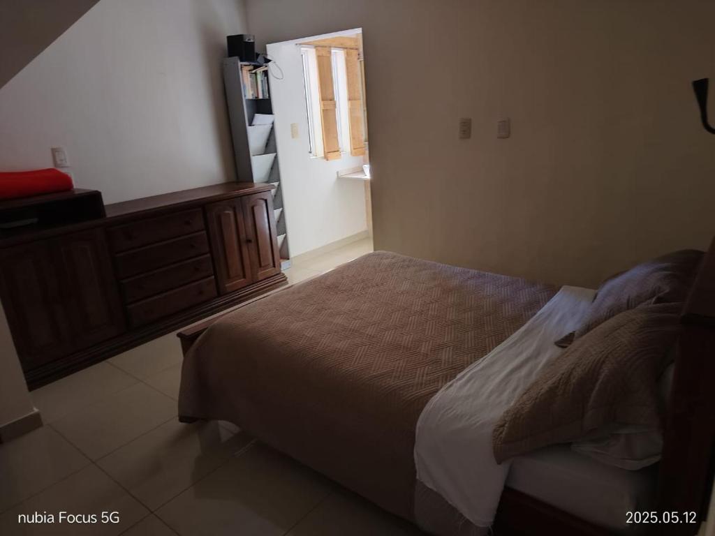 Ένα ή περισσότερα κρεβάτια σε δωμάτιο στο tranquilidad, confort y seguridad II