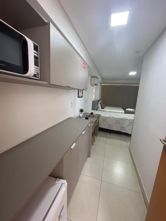Kuchyň nebo kuchyňský kout v ubytování Manaíra Apart Hotel