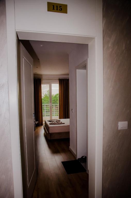 Postel nebo postele na pokoji v ubytování Hotel ERALD