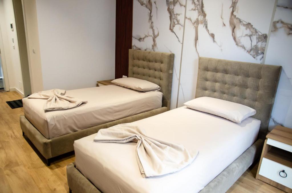 Postel nebo postele na pokoji v ubytování Hotel ERALD