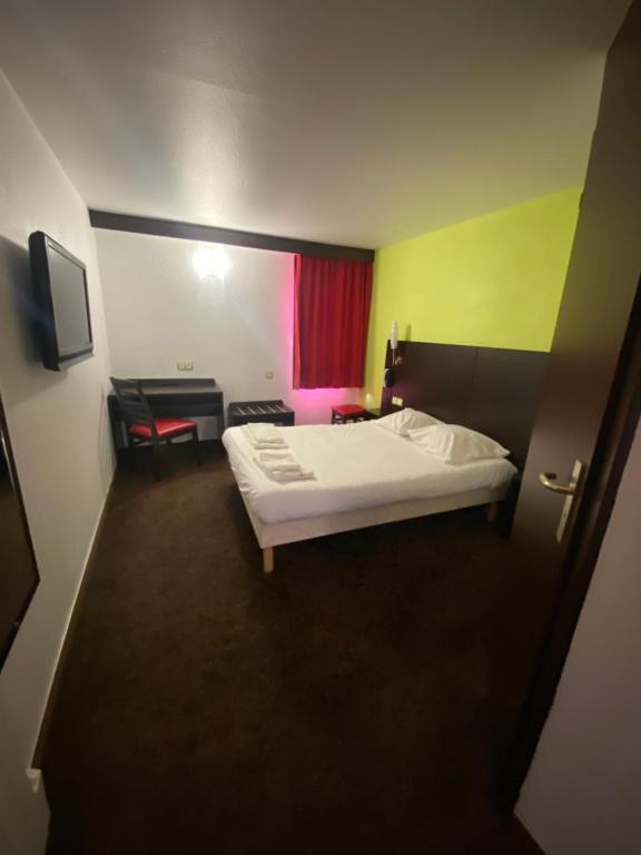 Postel nebo postele na pokoji v ubytování Enzo Hotels PONT-A-MOUSSON