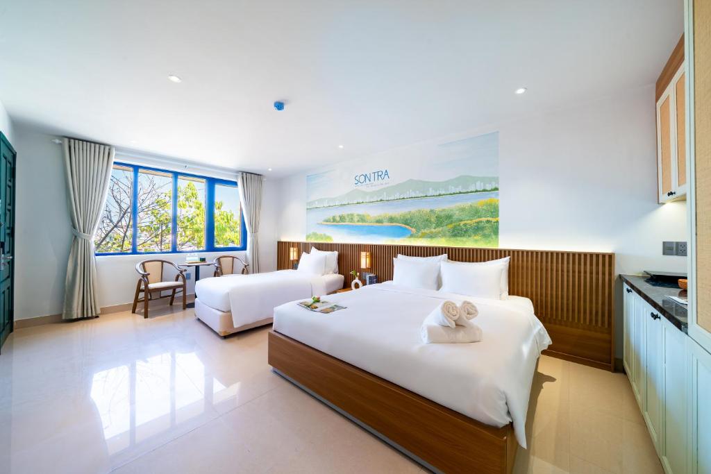 Giường trong phòng chung tại Sujet Residence Da Nang by Haviland