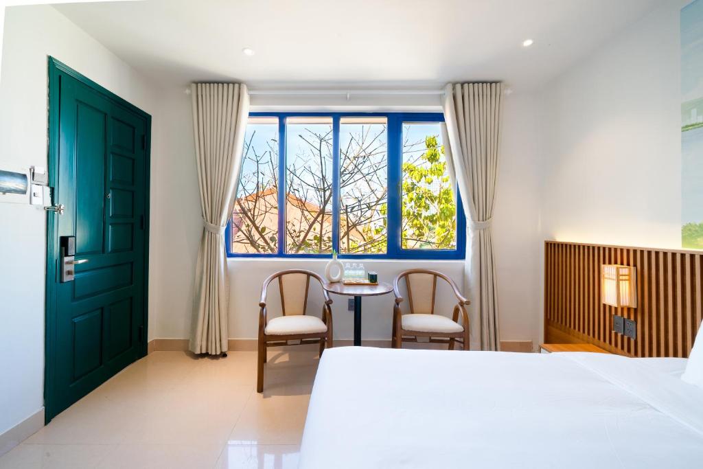 Giường trong phòng chung tại Sujet Residence Da Nang by Haviland