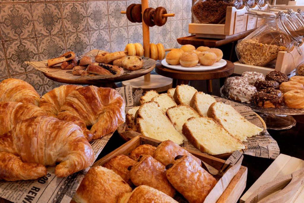 a bunch of different types of bread and pastries at Catalonia Málaga in Málaga