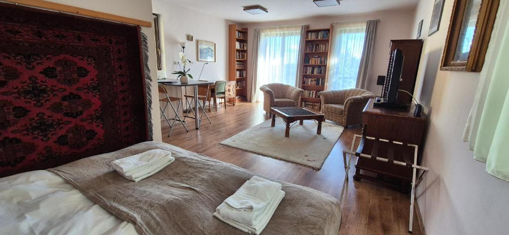 A bed or beds in a room at Sofia Apartment Kázmér