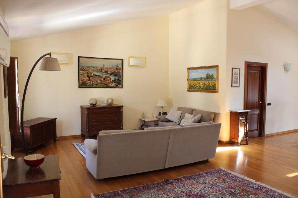 a living room with a couch and a table at Palazzo Cellesi in Pistoia