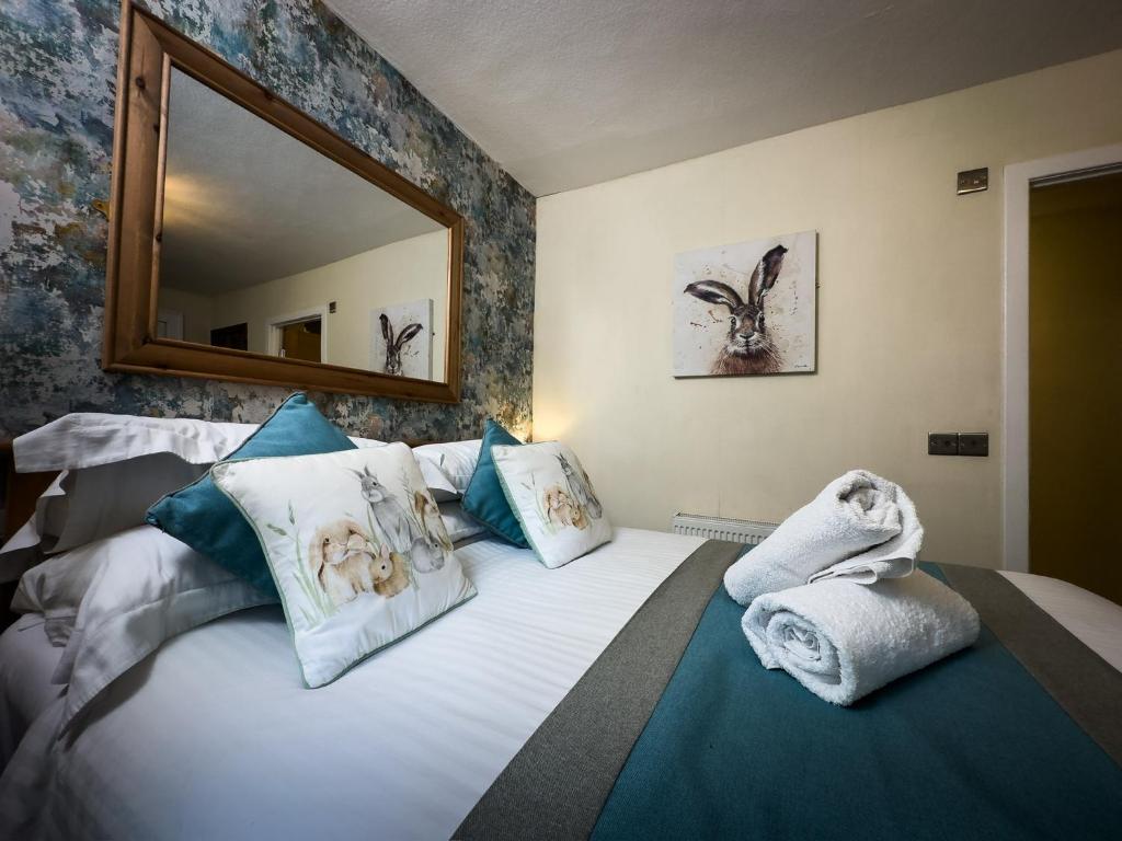 Postel nebo postele na pokoji v ubytování Borgie Lodge Hotel