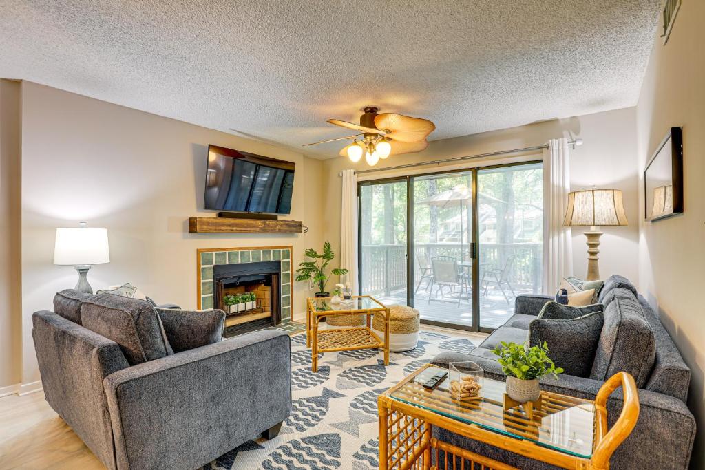 a living room with two couches and a fireplace at Private Deck & Pool Access: Myrtle Beach Getaway! in Myrtle Beach