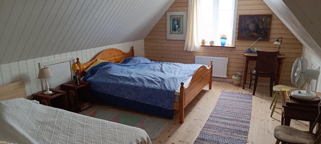 Postel nebo postele na pokoji v ubytování Rögnaröd 4604