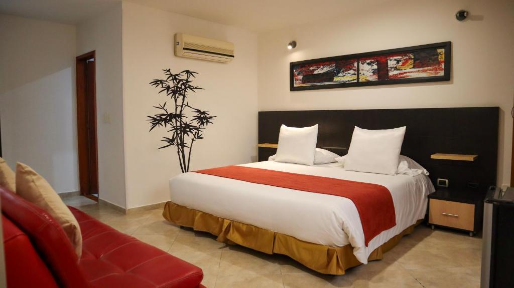 Postel nebo postele na pokoji v ubytování Hotel Alessio