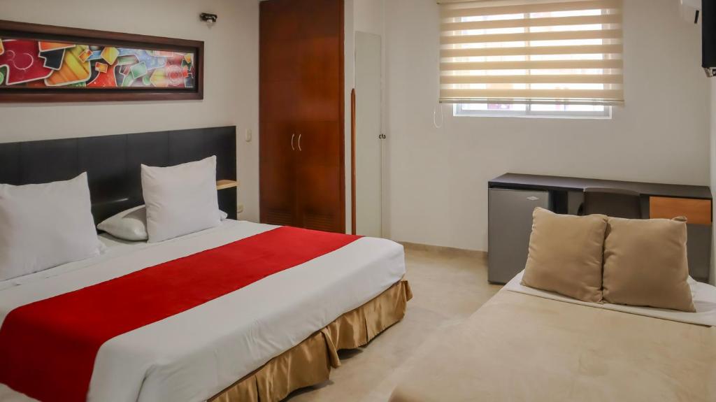 Postel nebo postele na pokoji v ubytování Hotel Alessio