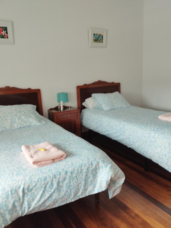 Łóżko lub łóżka w pokoju w obiekcie Villa Rica House