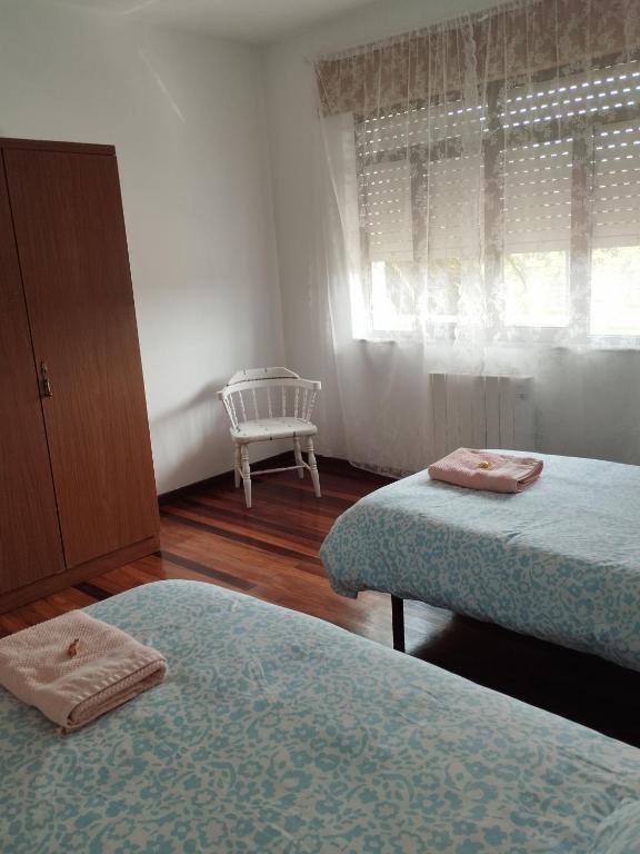 Łóżko lub łóżka w pokoju w obiekcie Villa Rica House