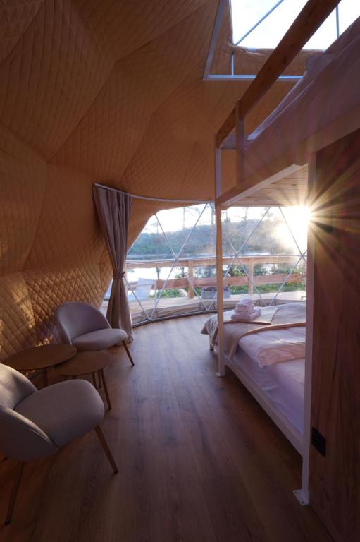 Voodi või voodid majutusasutuse Glamping Trhovky toas
