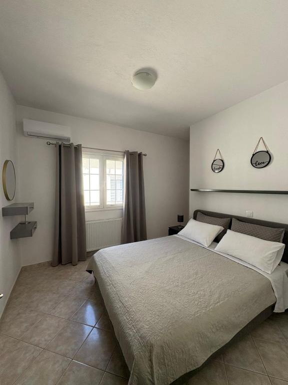 Postel nebo postele na pokoji v ubytování ATHOS APARTMENT