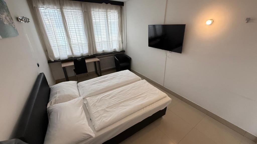 Katil atau katil-katil dalam bilik di Hotel San Carlo