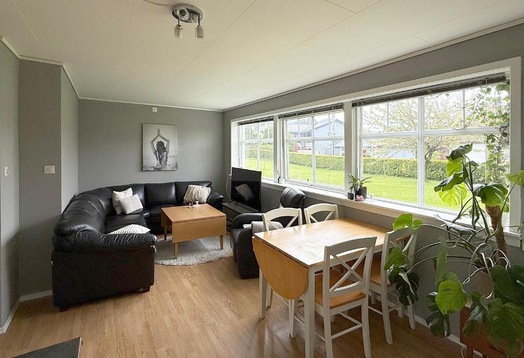 a living room with a couch and a table at Haugane in Selje