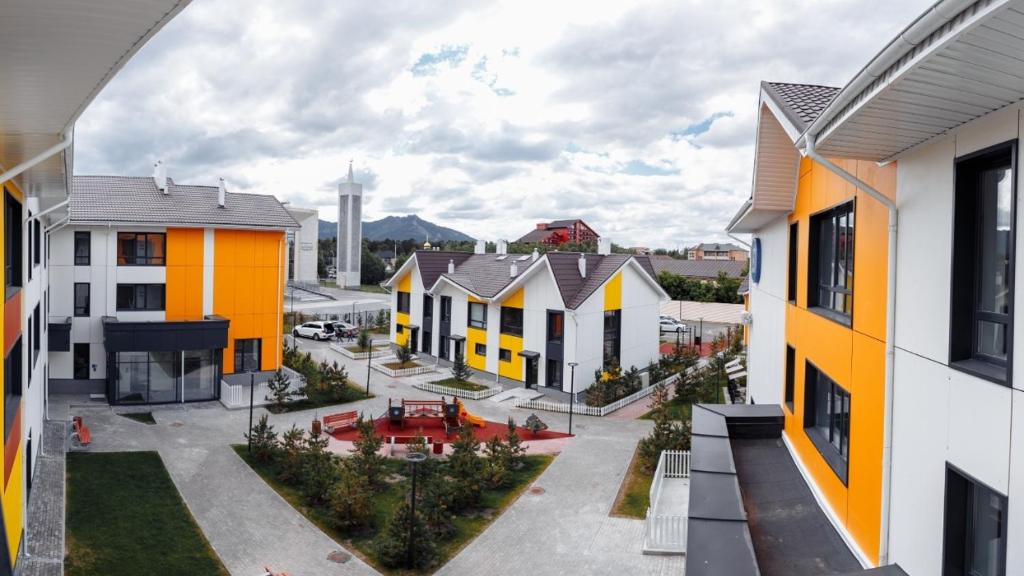 a view of a row of houses in a city at Prominad Burabai 45P in Borovoye