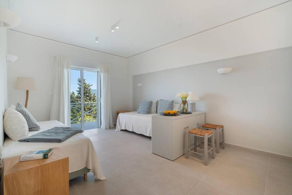 A bed or beds in a room at Myrto Homes Lefkada Agios Nikitas Greece