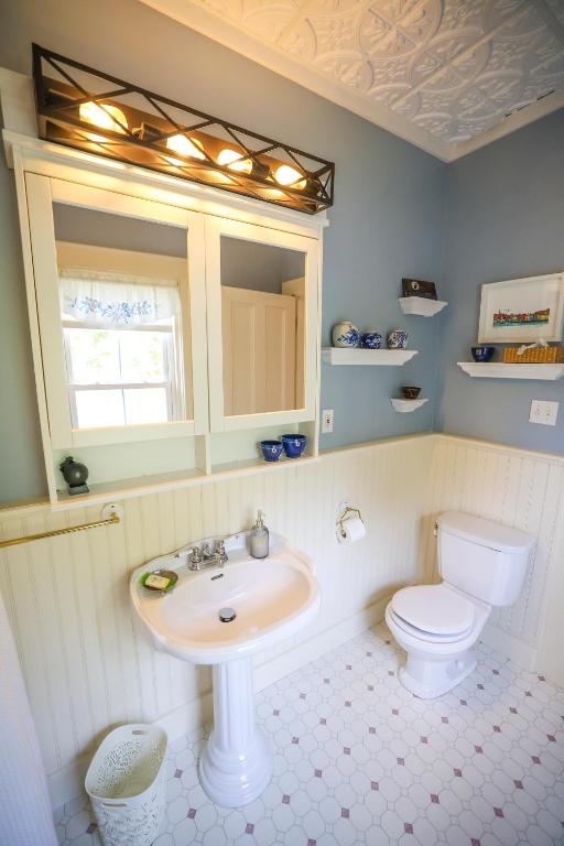 a bathroom with a sink and a toilet at The Lark & Loon Inn in Annapolis Royal