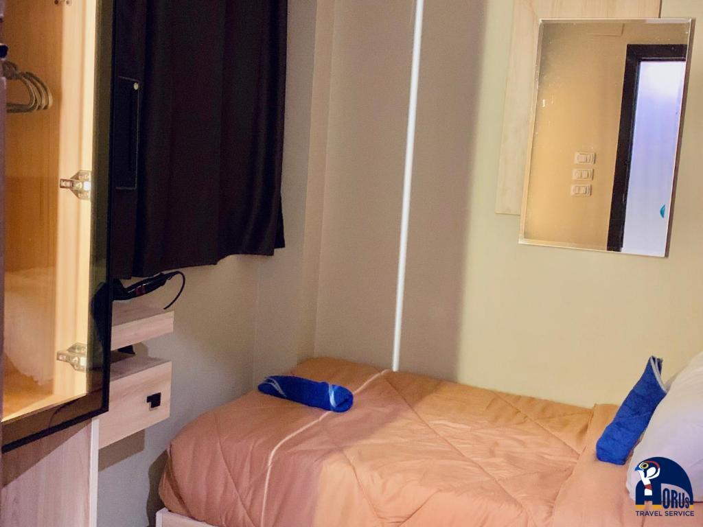 Postel nebo postele na pokoji v ubytování Horus Horizon INN