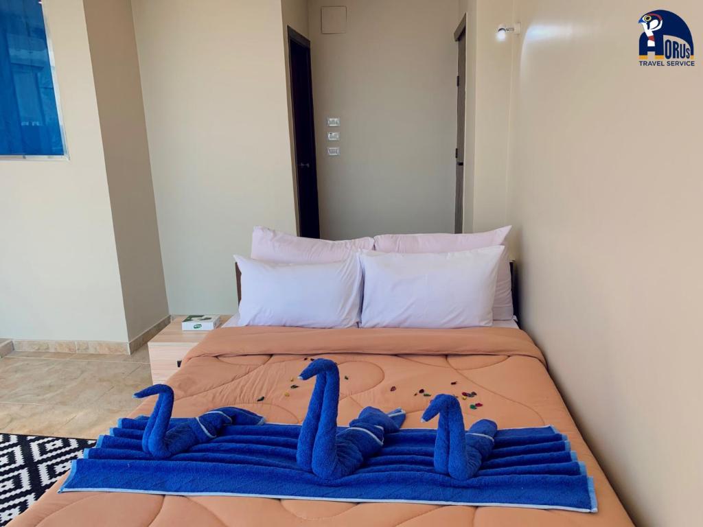 Postel nebo postele na pokoji v ubytování Horus Horizon INN