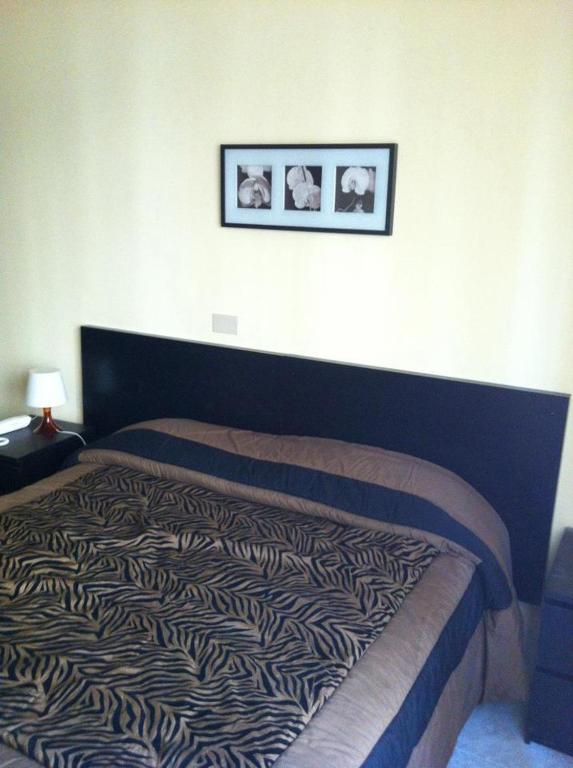 Кровать или кровати в номере Hotel Milanesina