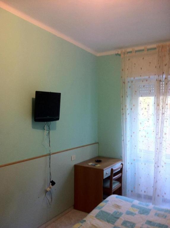 Телевизор и/или развлекательный центр в Hotel Milanesina