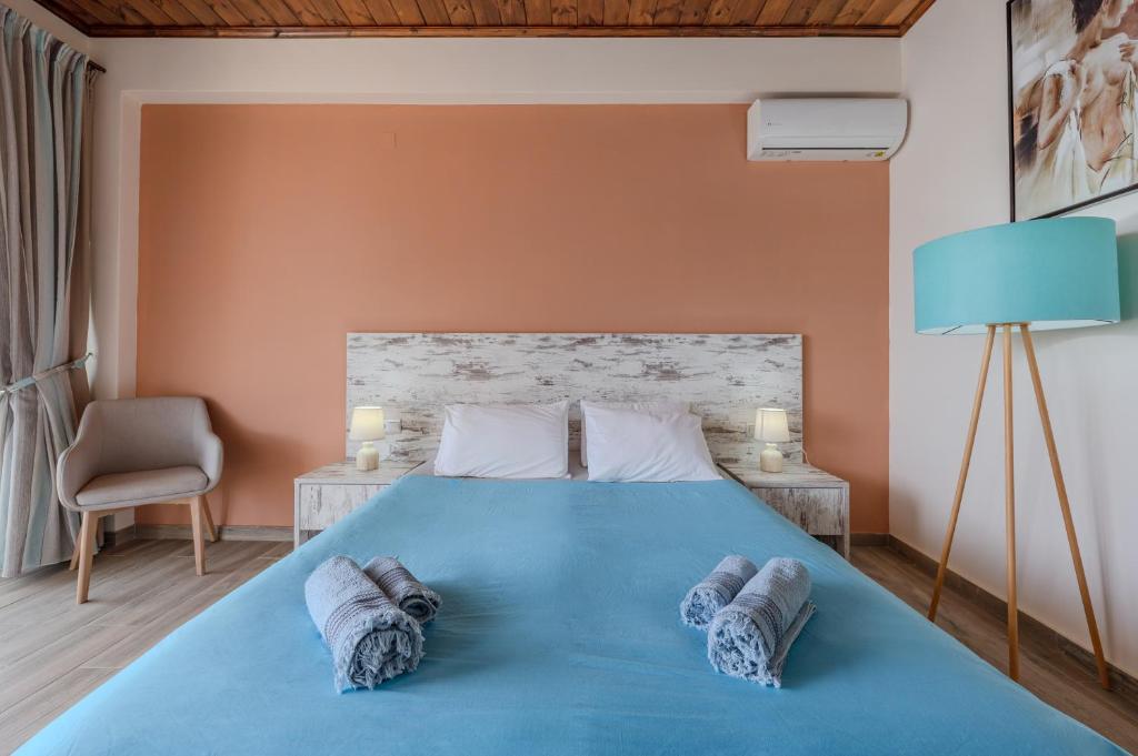 Posteľ alebo postele v izbe v ubytovaní Souda Bay Cottage
