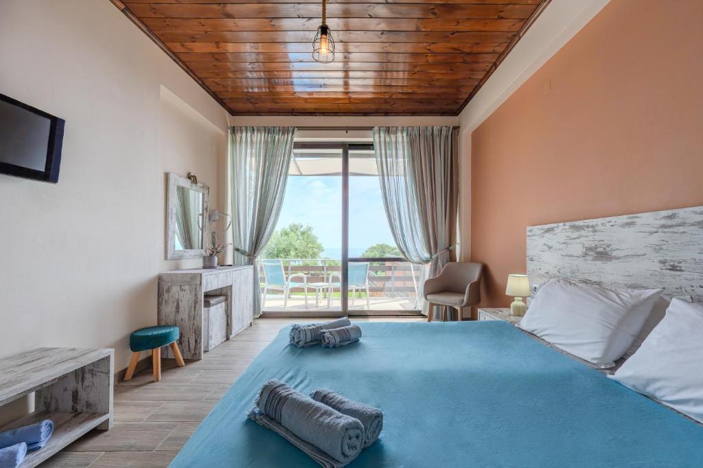 Posteľ alebo postele v izbe v ubytovaní Souda Bay Cottage