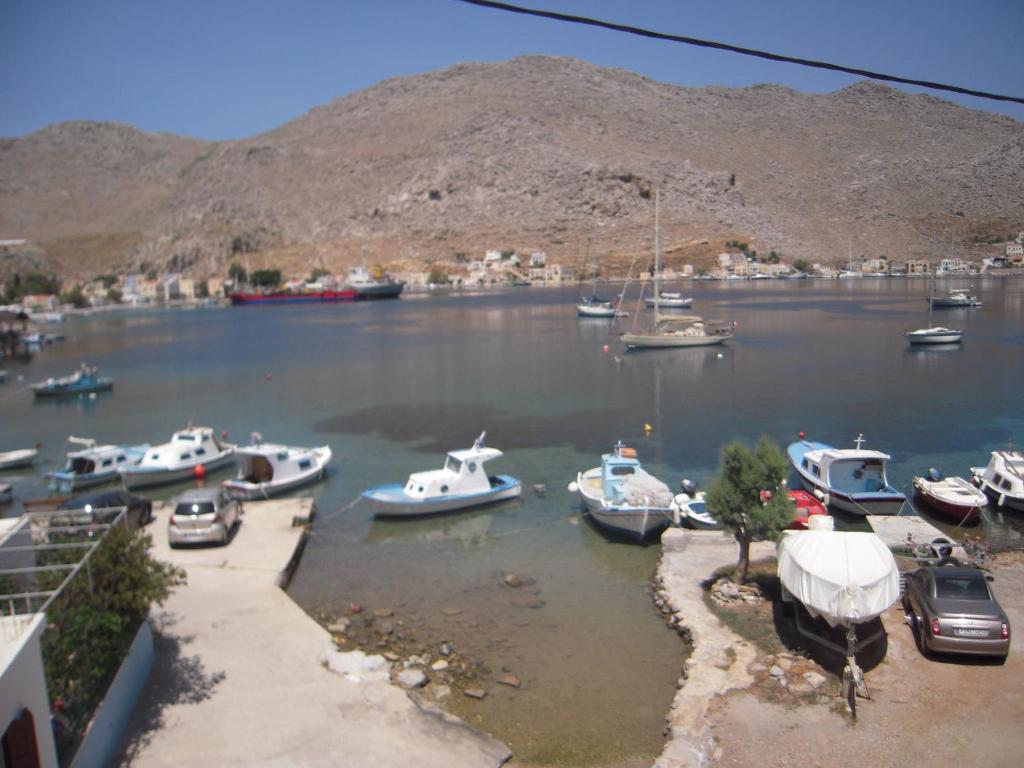 a group of boats docked in a harbor at Pedi Breeze in Symi