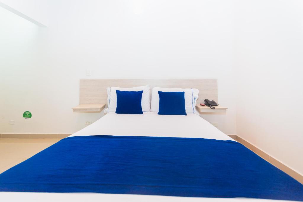 Postel nebo postele na pokoji v ubytování Hotel Suite del Parque