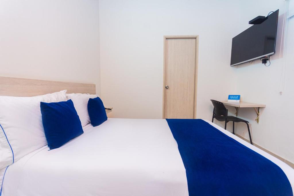 Postel nebo postele na pokoji v ubytování Hotel Suite del Parque