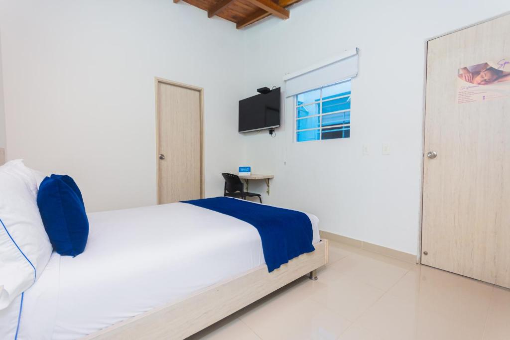 Postel nebo postele na pokoji v ubytování Hotel Suite del Parque