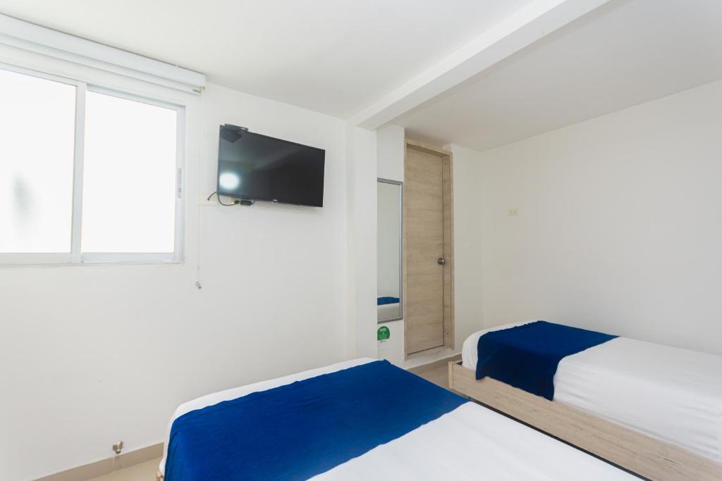Postel nebo postele na pokoji v ubytování Hotel Suite del Parque