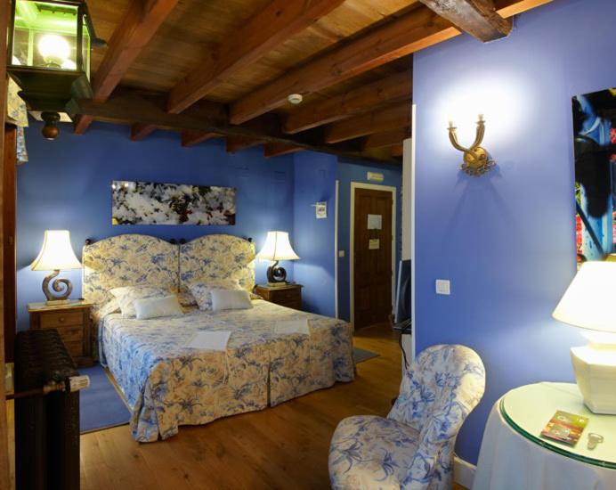 Postel nebo postele na pokoji v ubytování Hotel Rural Casa Xusto