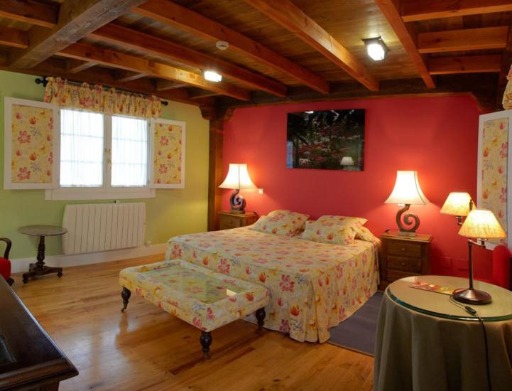 Postel nebo postele na pokoji v ubytování Hotel Rural Casa Xusto