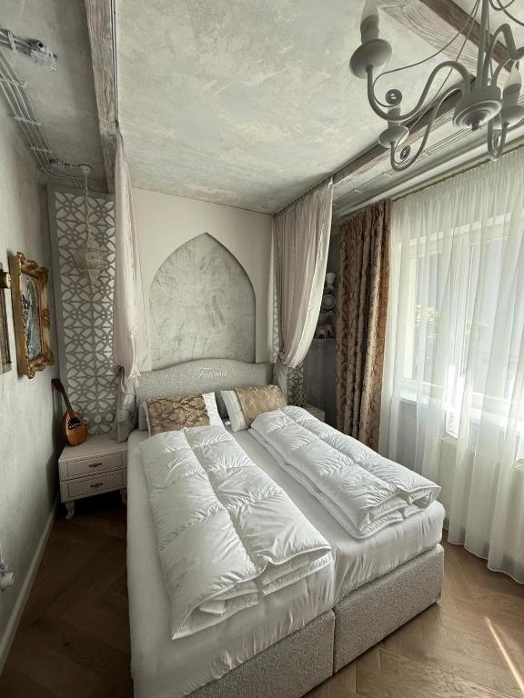 Postel nebo postele na pokoji v ubytování KAVart apartments