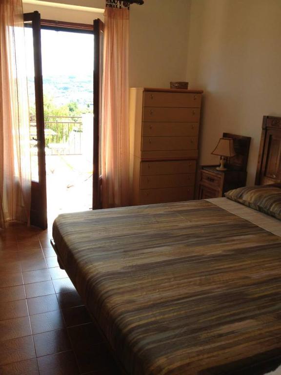 A bed or beds in a room at La Corte del Borgo