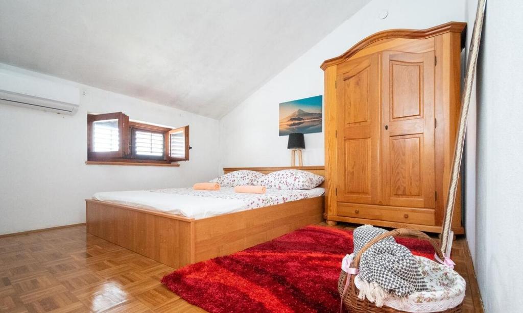 Postel nebo postele na pokoji v ubytování Apartmani Điran